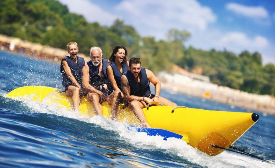 Tourists enjoying a banana boat ride in Goa